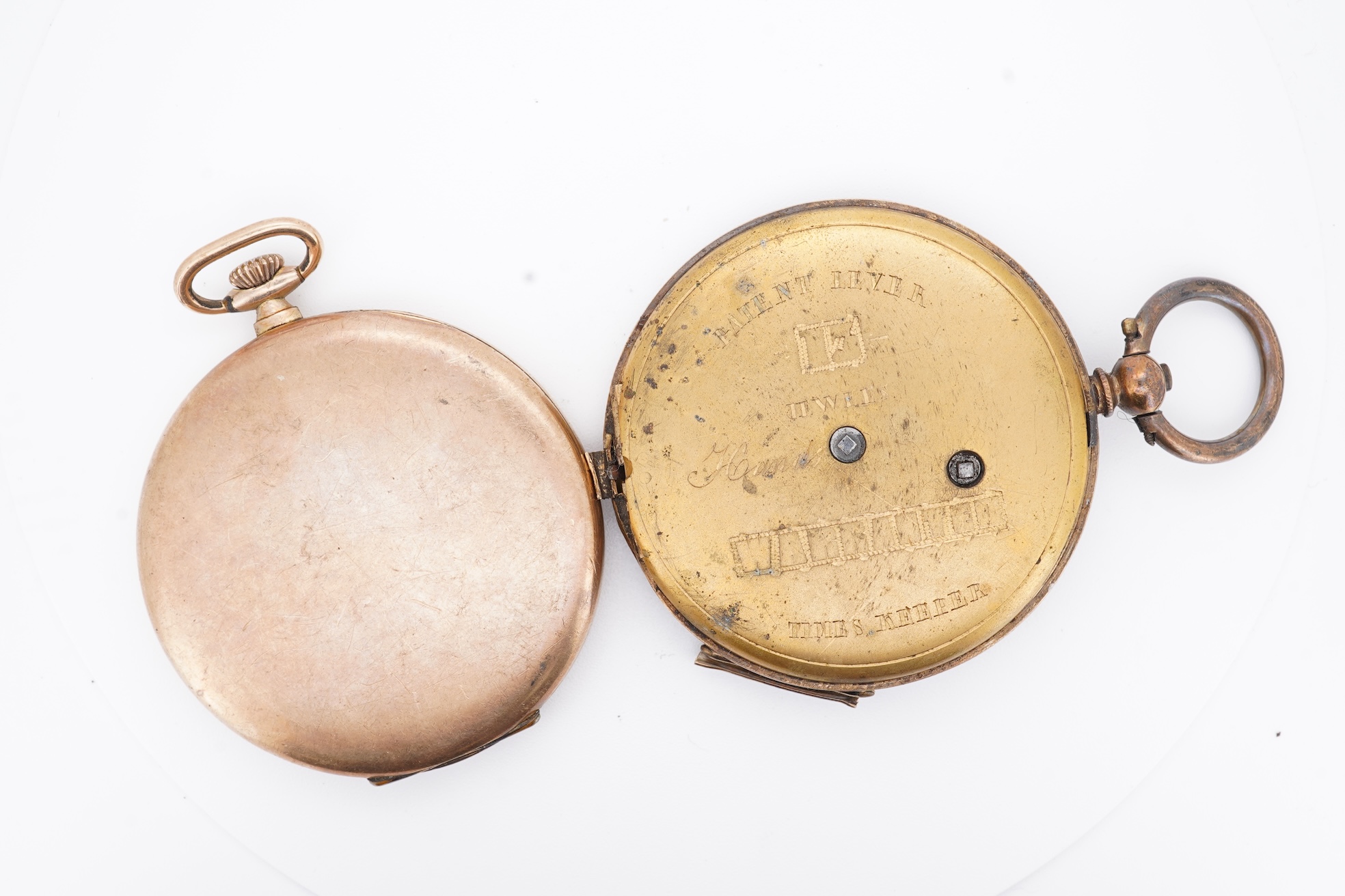 A damaged continental 18k lever pocket watch, together with a rolled gold pocket watch in similar condition.
